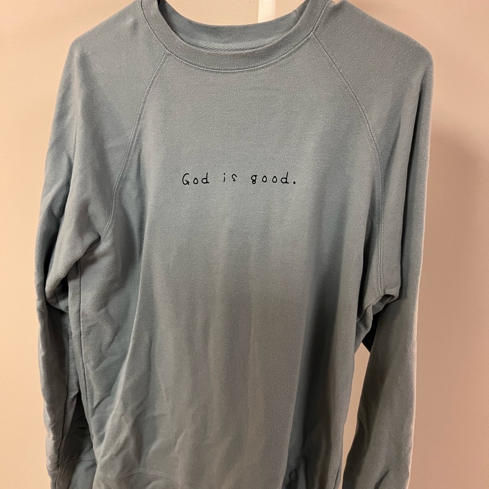 Blue Long Sleeve Shirt with 'God is good.' Text